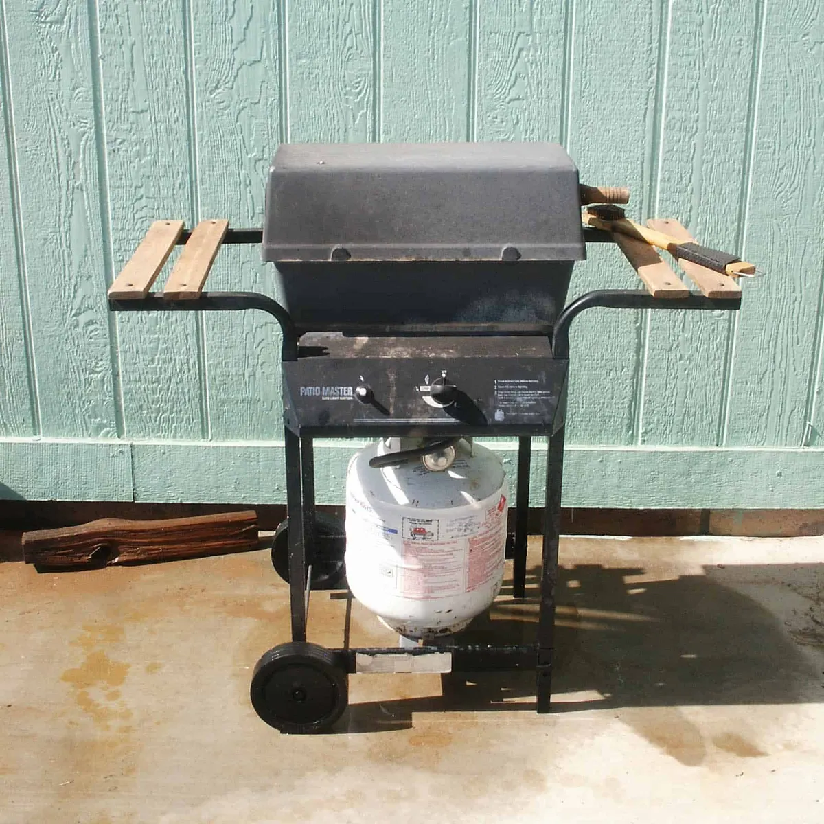 BBQ gas hookup installation with grill running on natural gas
