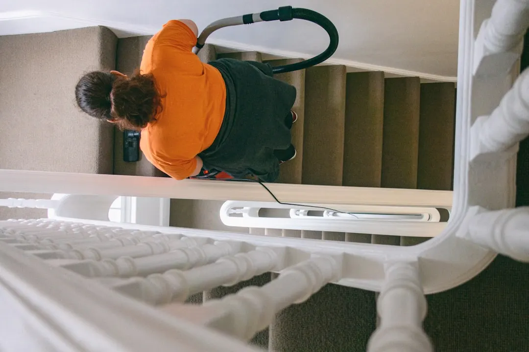 Duct cleaning technician with HEPA vacuum in Orlando
