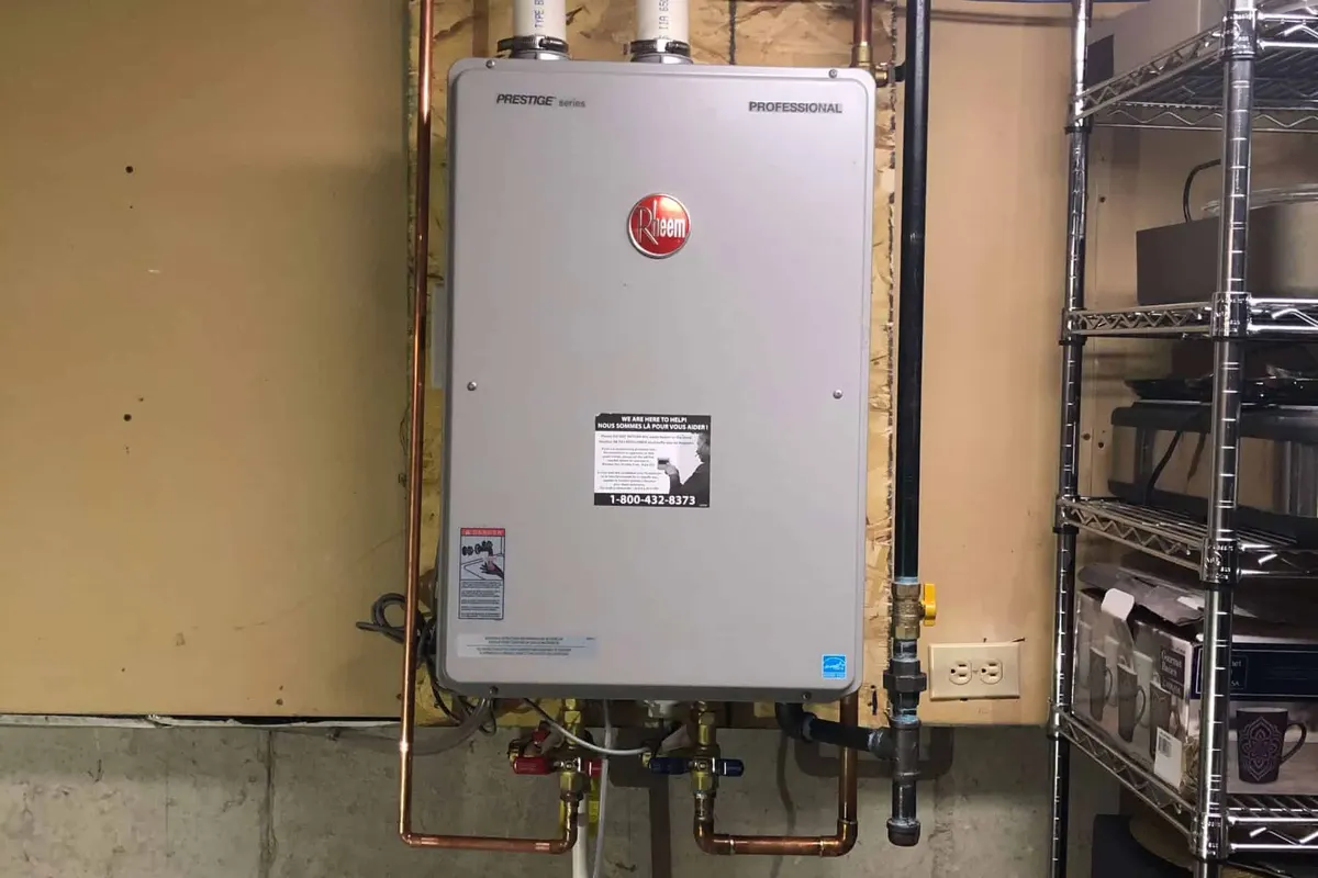Rheem tankless water heater installed on a wall in a Orlando basement